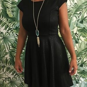 Snap “little black dress” faux snakeskin theme.